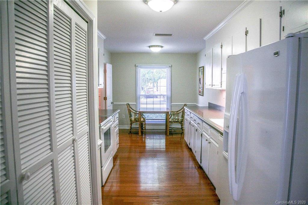 4417 Simsbury Road Charlotte, NC 28226 - Photo 29 of 42 a kitchen with counter top space and wooden floor