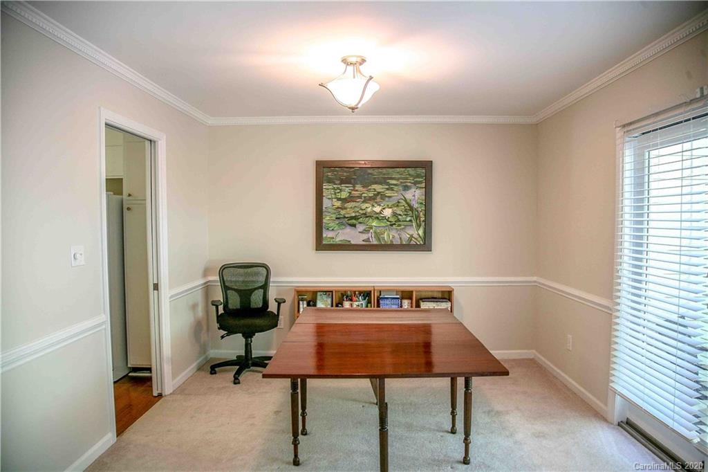 4417 Simsbury Road Charlotte, NC 28226 - Photo 30 of 42 a view of a workspace with furniture and a window