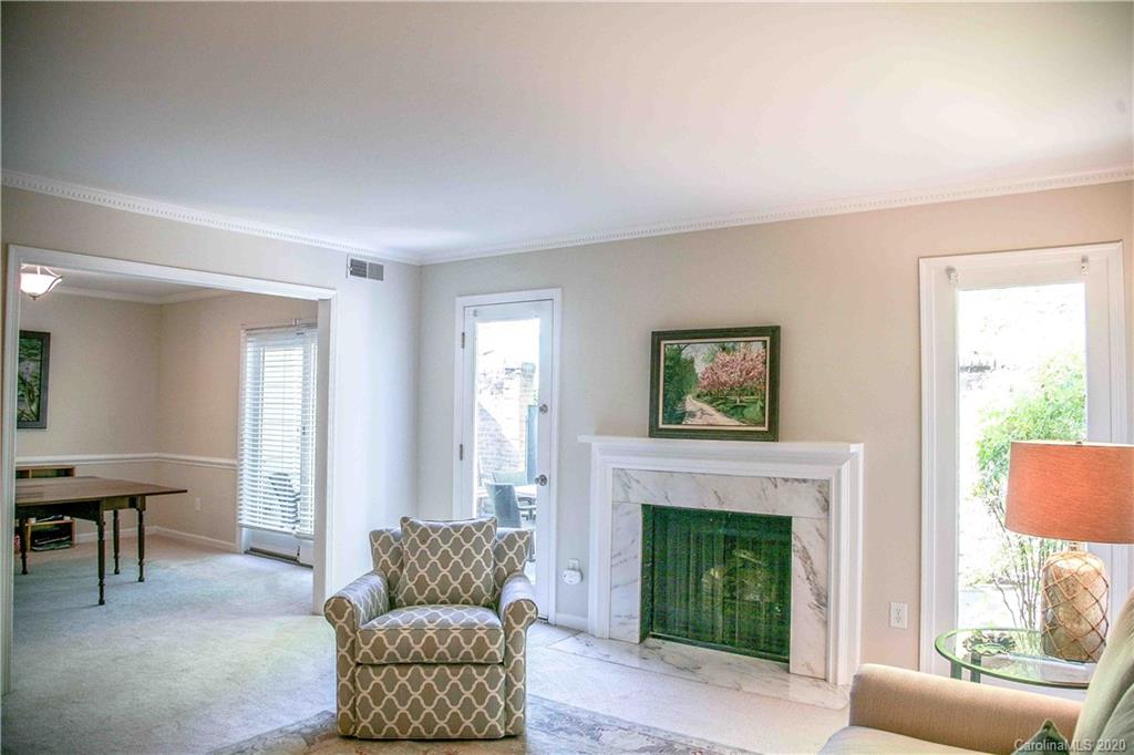 4417 Simsbury Road Charlotte, NC 28226 - Photo 4 of 42 a living room with furniture and a fireplace