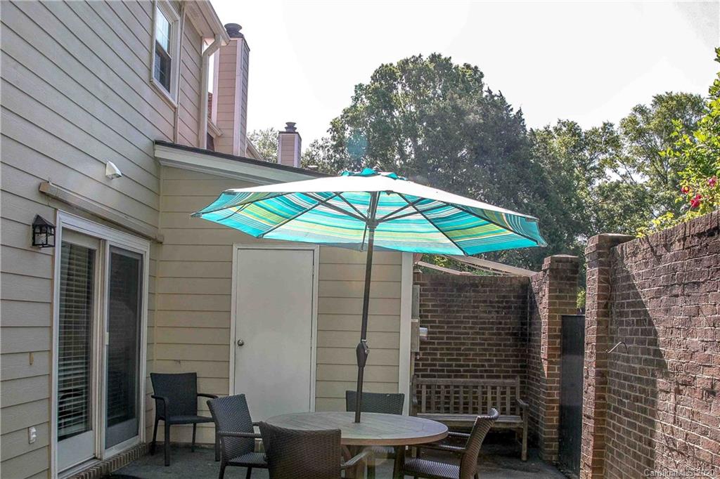 4417 Simsbury Road Charlotte, NC 28226 - Photo 35 of 42 a blue and white umbrella sitting in front of a house