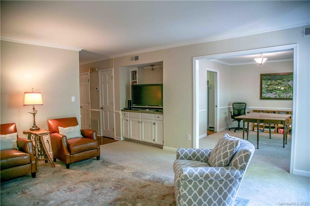 4417 Simsbury Road Charlotte, NC 28226 - Photo 5 of 42 a living room with furniture and a flat screen tv
