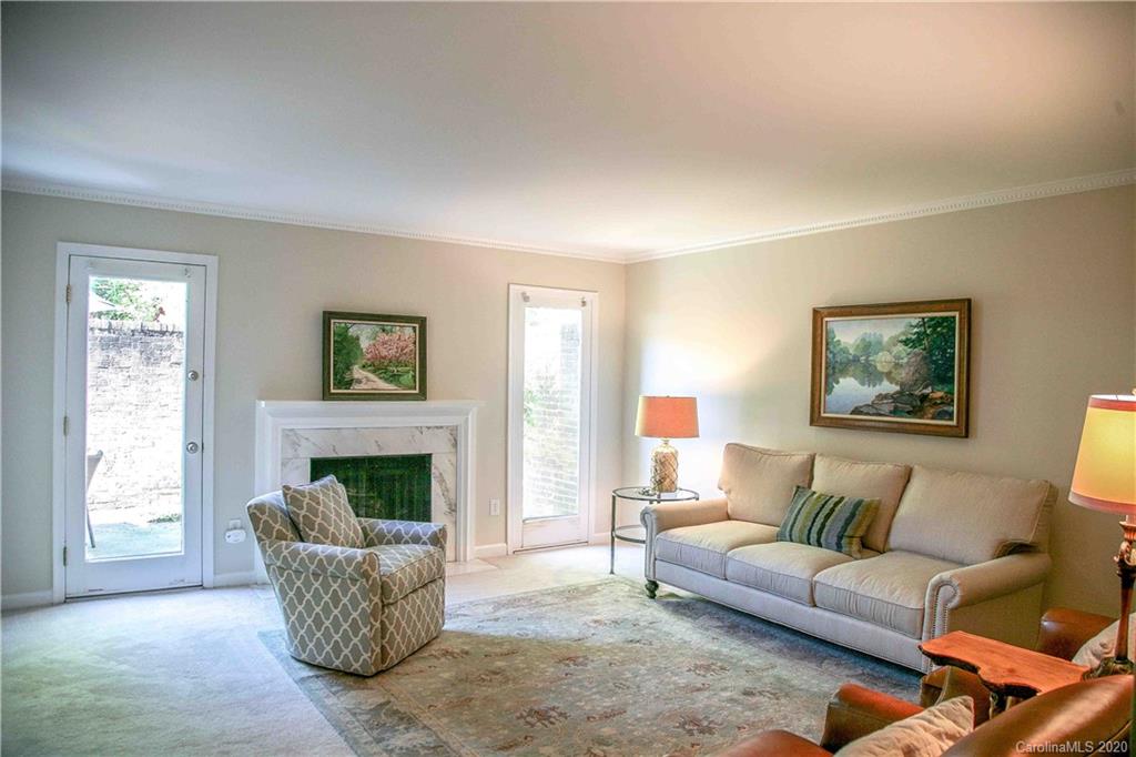 4417 Simsbury Road Charlotte, NC 28226 - Photo 7 of 42 a living room with furniture and a fireplace