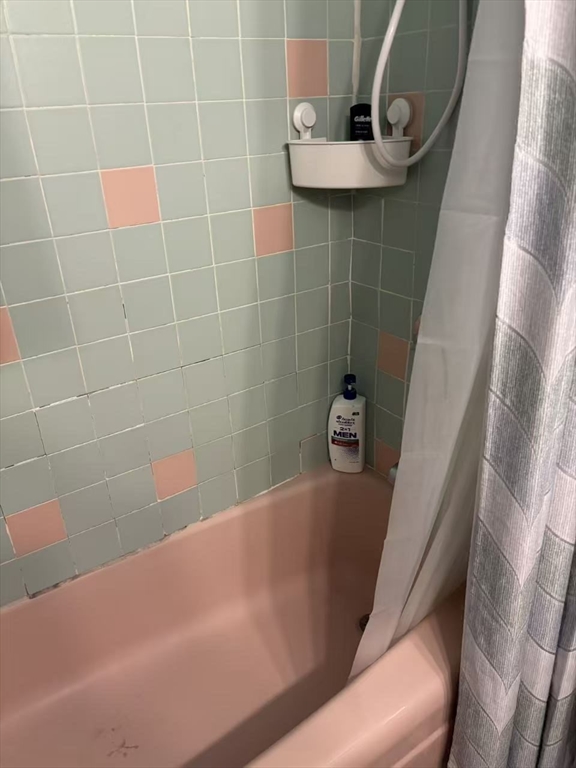 200 Swanton Street, Unit 237 Winchester, MA 01890 - Photo 7 of 14 a bathroom with a bathtub