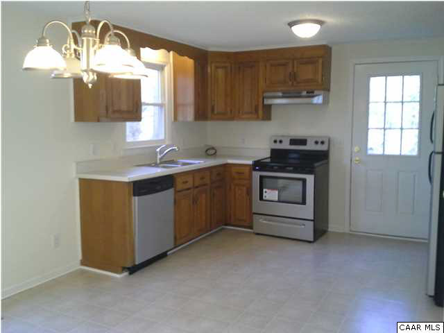 94 Carnation Road Ruckersville, VA 22968 - Photo 3 of 34 a kitchen with a stove a sink and a window