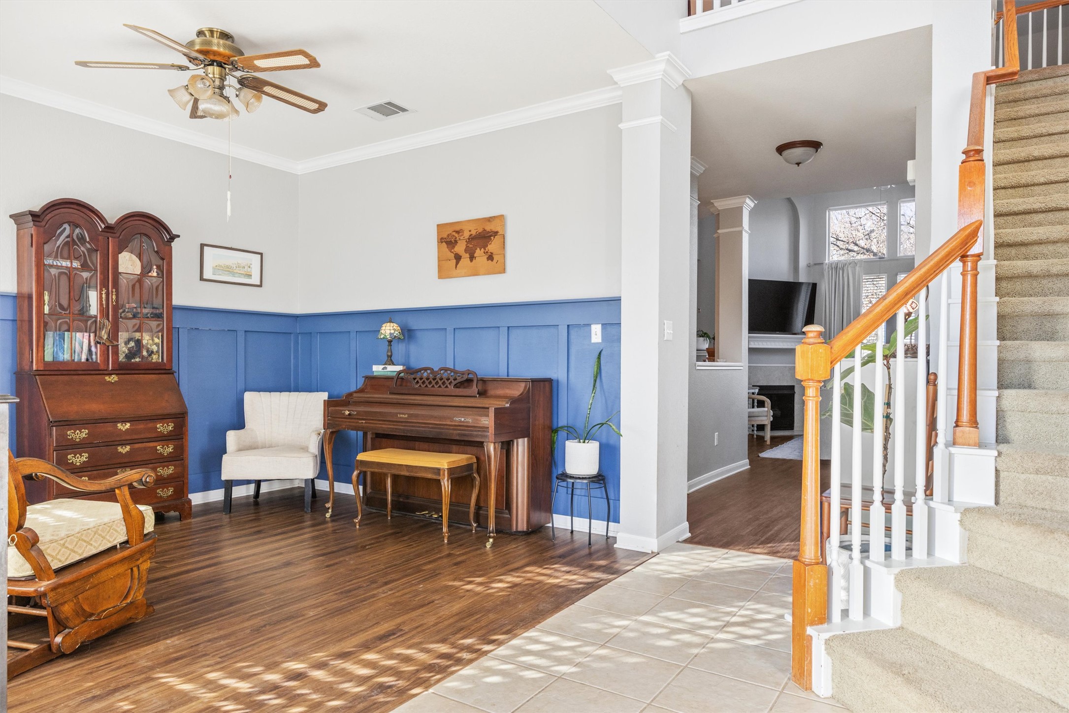 122 Summers Green Georgetown, TX 78633 - Photo 11 of 22 Sitting room featuring a wainscoted wall, a ceiling fan, crown molding, a decorative wall, and tile patterned floors