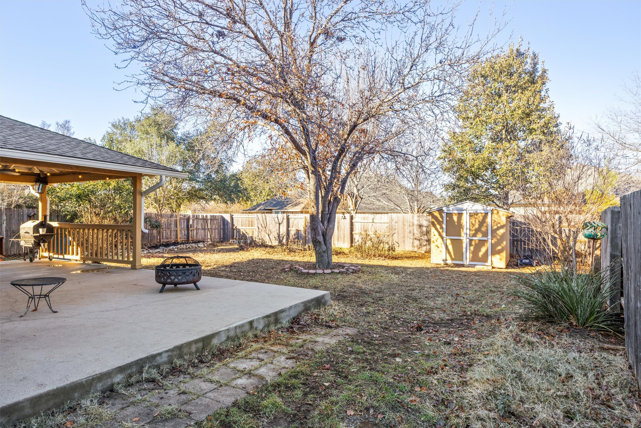 122 Summers Green Georgetown, TX 78633 - Photo 15 of 22 Fenced backyard with a fire pit, a patio area, and an outbuilding
