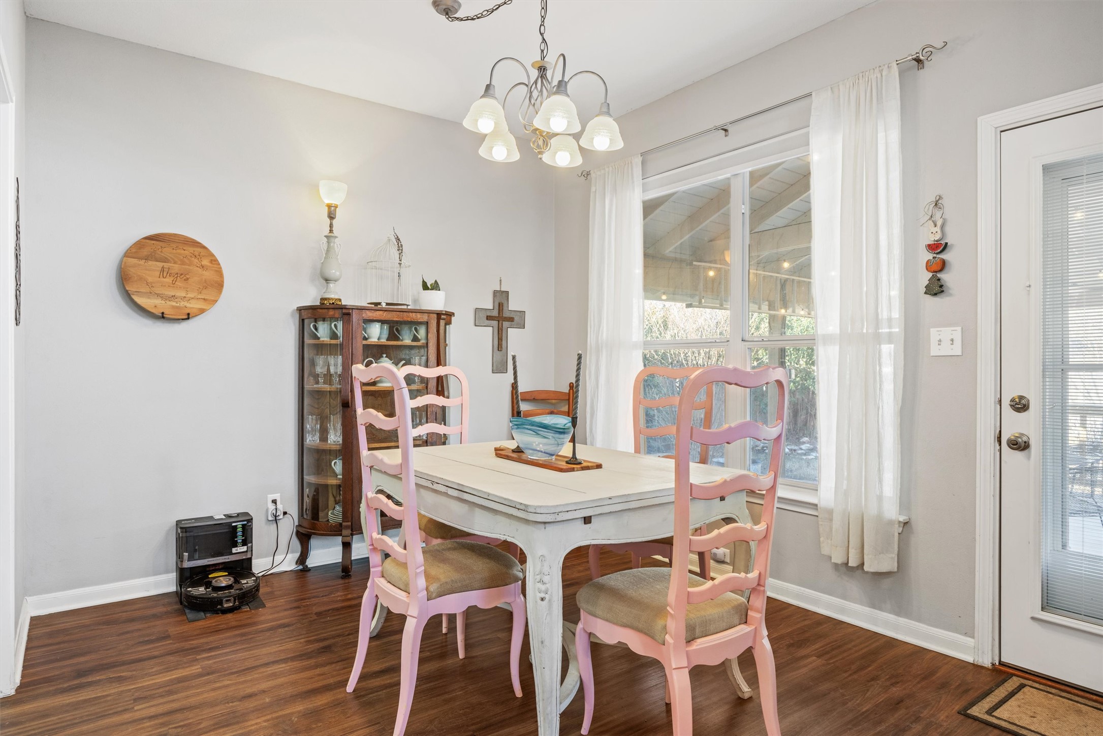 122 Summers Green Georgetown, TX 78633 - Photo 9 of 22 Dining area with a chandelier and dark wood finished floors