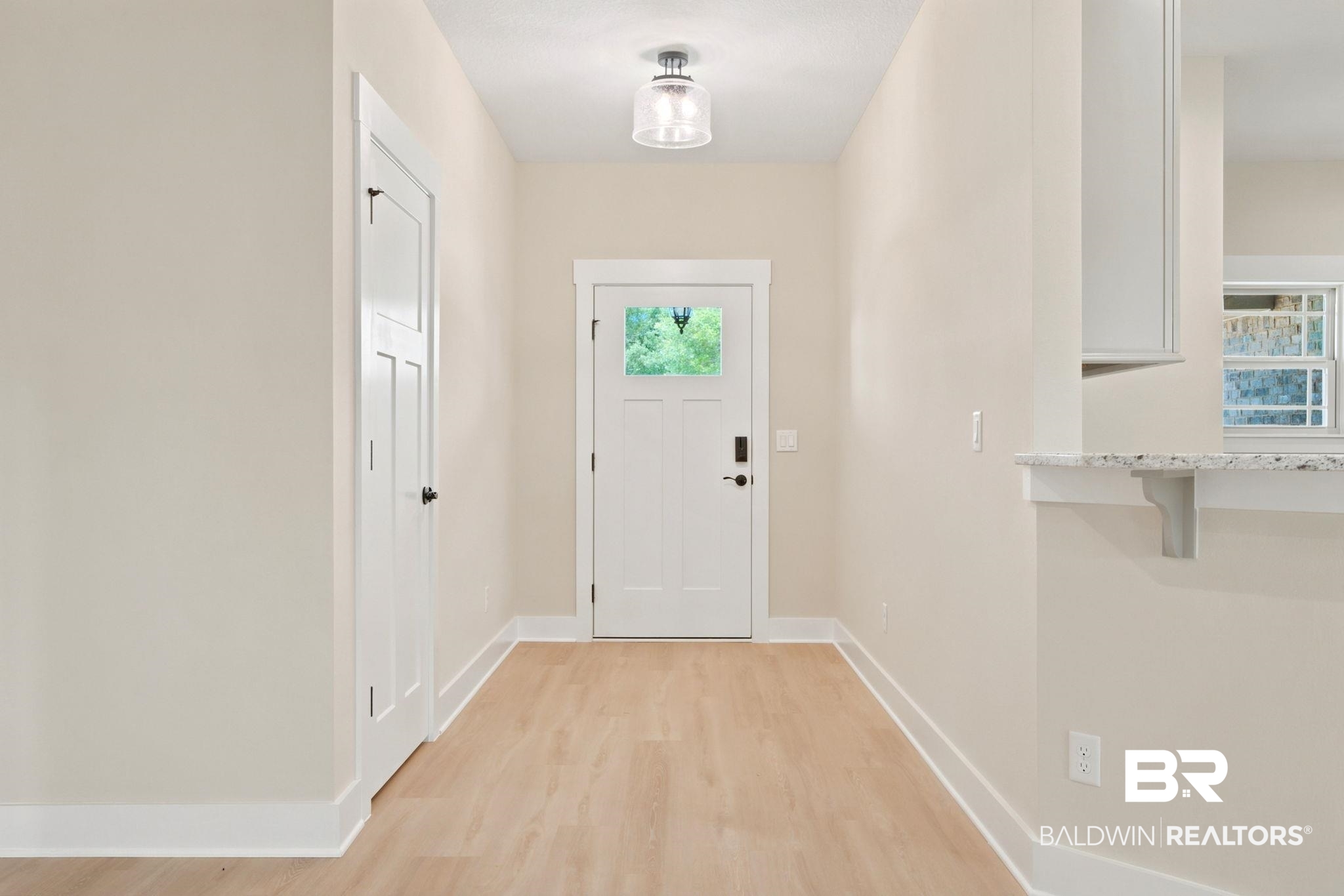 32656 Arbor Ridge Circle Lillian, AL 36549 - Photo 2 of 56 Foyer featuring light wood-finish flooring, a contemporary flush mount light fixture, and a paneled entry door with a frosted glass insert