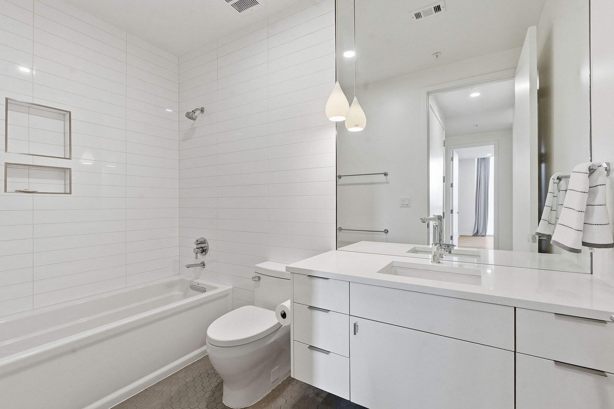 1010 West 10th Street, Unit 203 Austin, TX 78703 - Photo 18 of 20 a bathroom with a sink a toilet and shower
