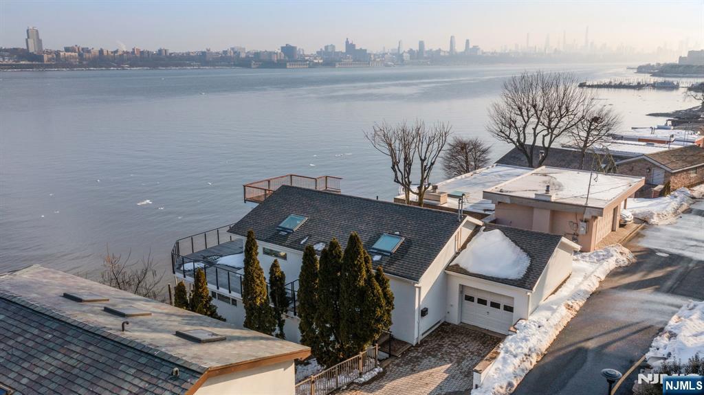 27 Shore Road Edgewater, NJ 07020 - Photo 47 of 48 a view of a lake with a terrace