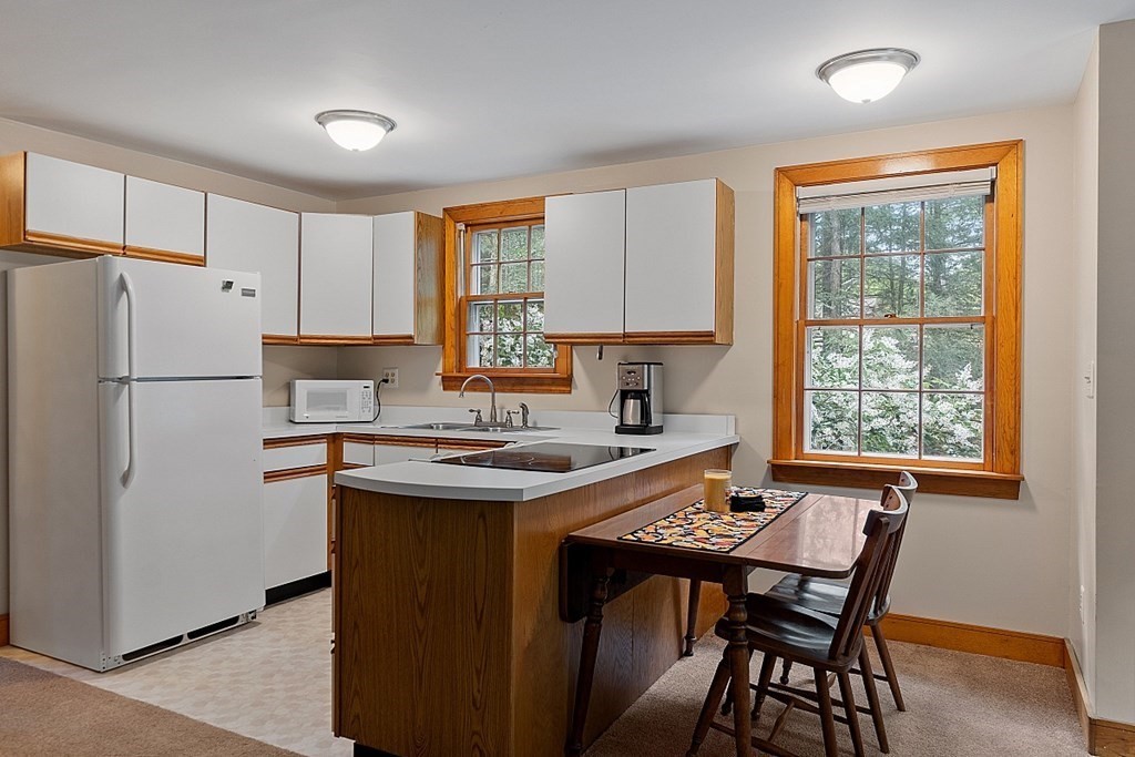 187 Red Acre Road Stow, MA 01775 - Photo 19 of 27 a kitchen with a refrigerator a stove a sink and a refrigerator