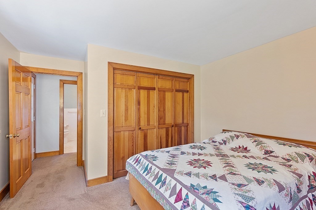 187 Red Acre Road Stow, MA 01775 - Photo 20 of 27 a bedroom with a bed and a window