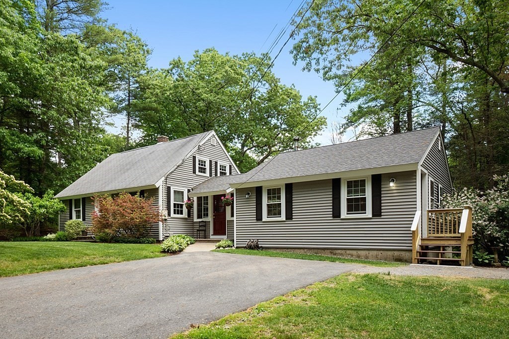 187 Red Acre Road Stow, MA 01775 - Photo 27 of 27 a front view of a house with a garden
