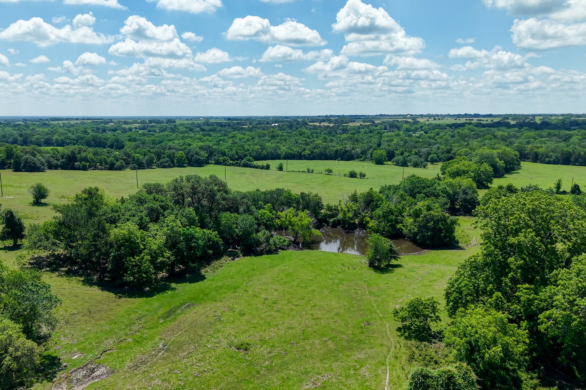5018 Wolters Road Schulenburg, TX 78956 - Photo 17 of 39 an aerial view of a houses with outdoor space and trees all around
