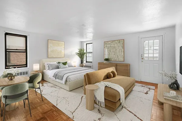 a bedroom with a bed and couch