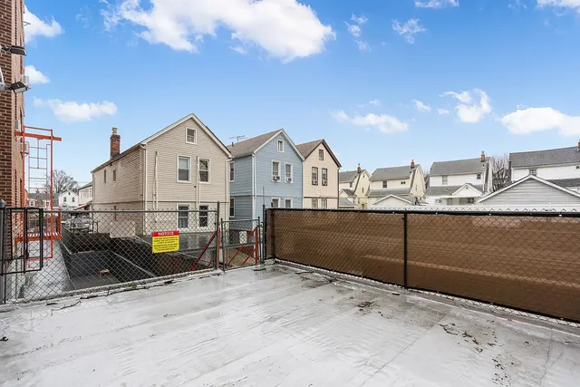 a view of a terrace with wooden fence