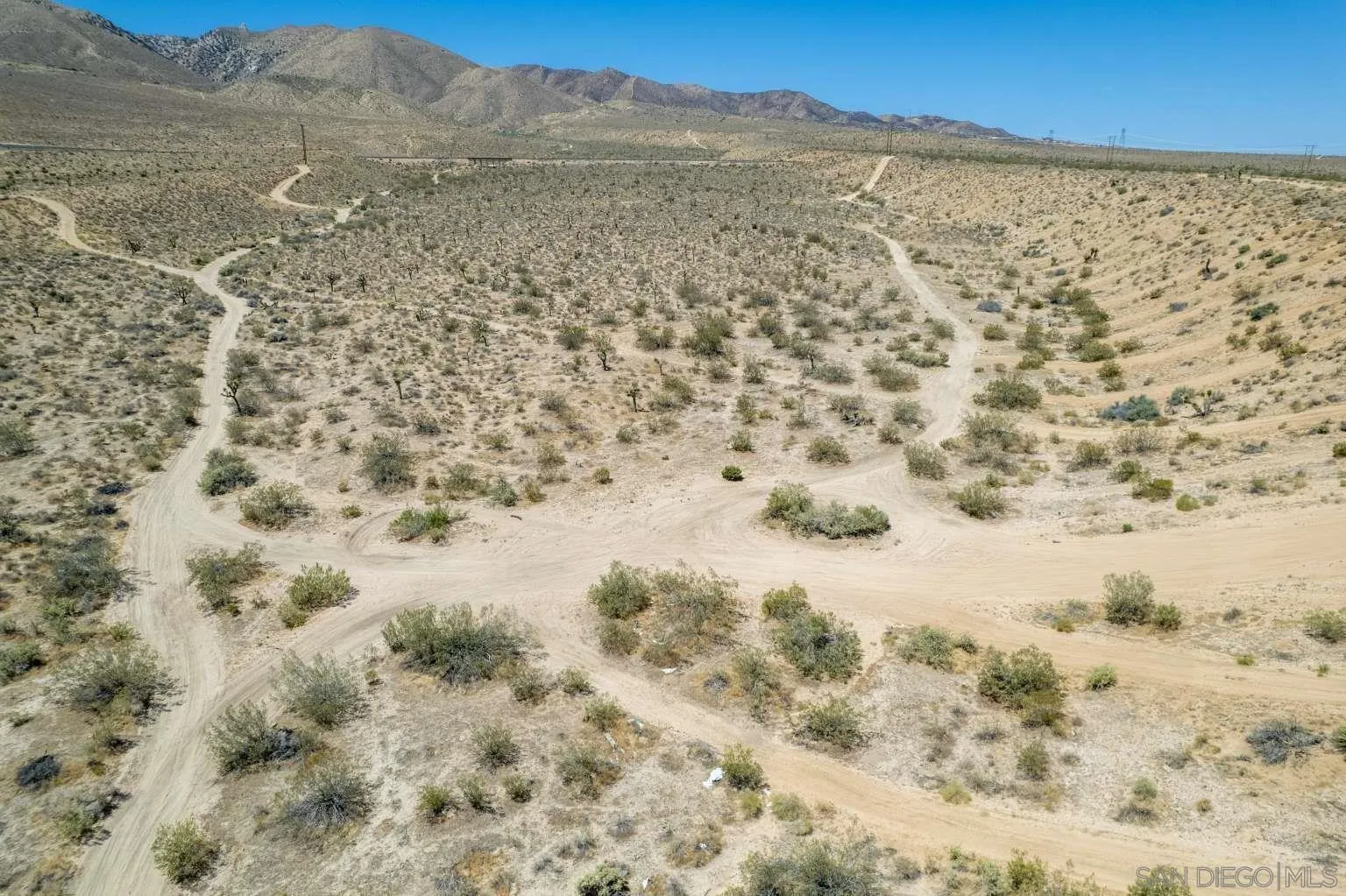 0 Joshua Road Lucerne Valley, CA 92356 - Photo 23 of 40 a view of a dry yard covered with snow
