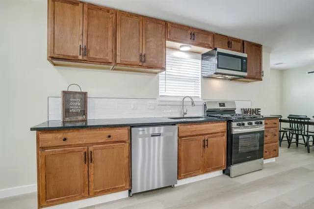 a view of a dining table and chairs in a room