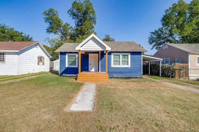 front view of a house with a yard