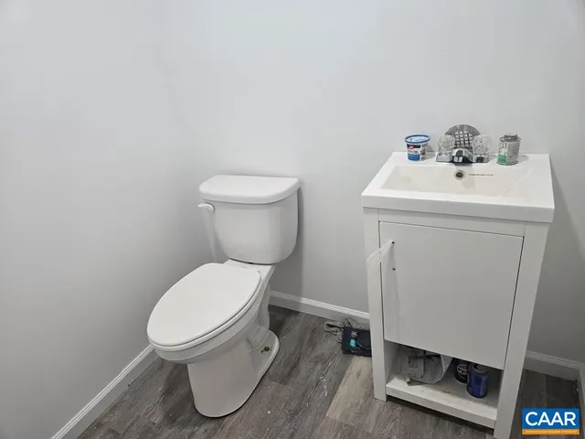a white toilet sitting next to a bathroom sink