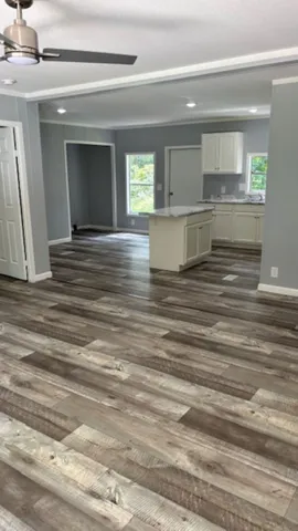 a view of kitchen and empty room