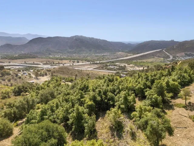 a view of a town with mountains in the background