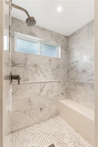 an aerial view of a houses with a lake view