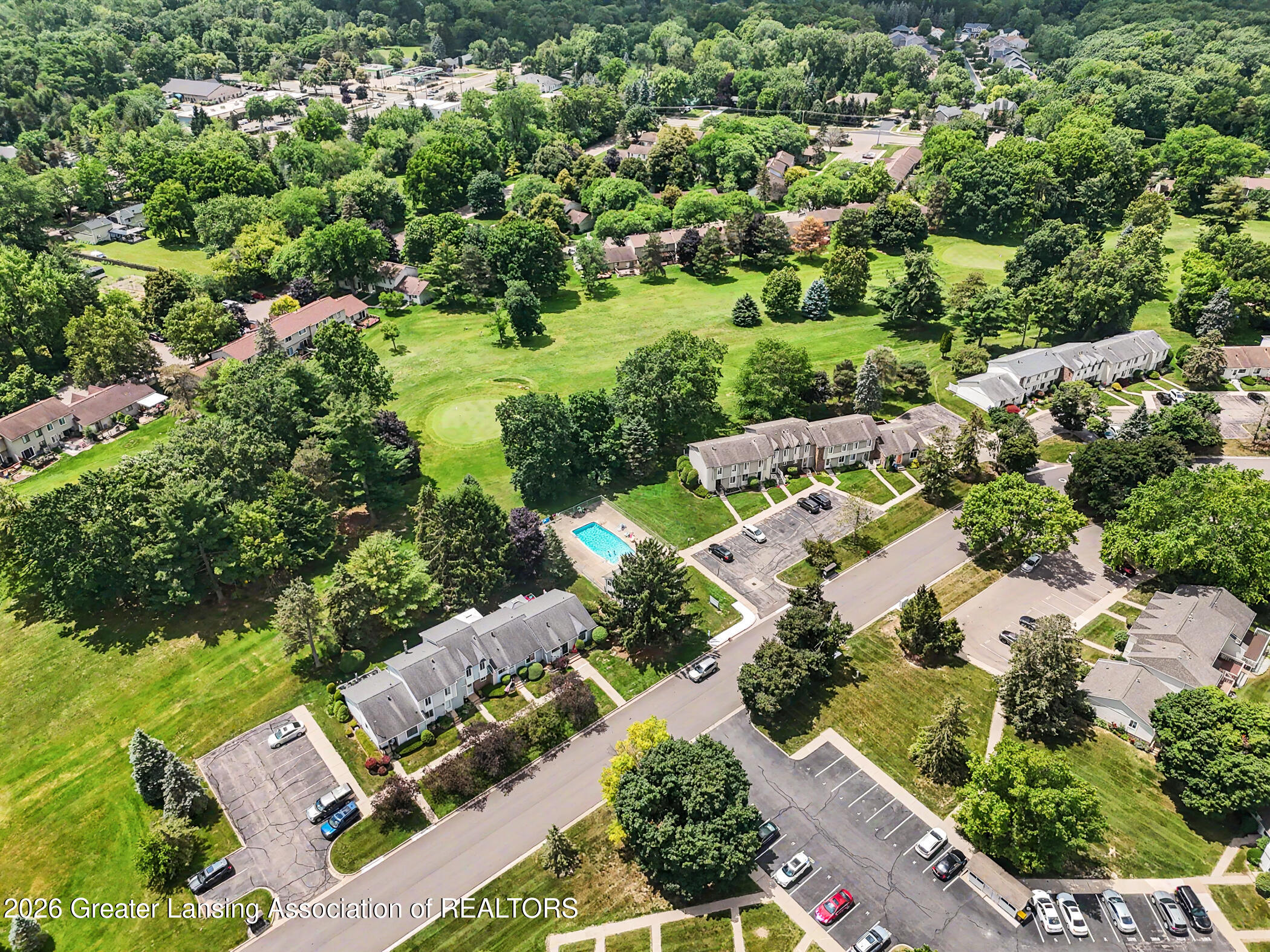 2059 La Mer Lane, Unit 17 Haslett, MI 48840 - Photo 34 of 48 Community Pool Aerial