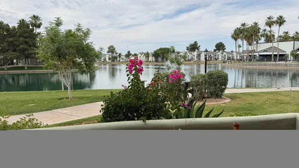 a view of a lake with a house in the background