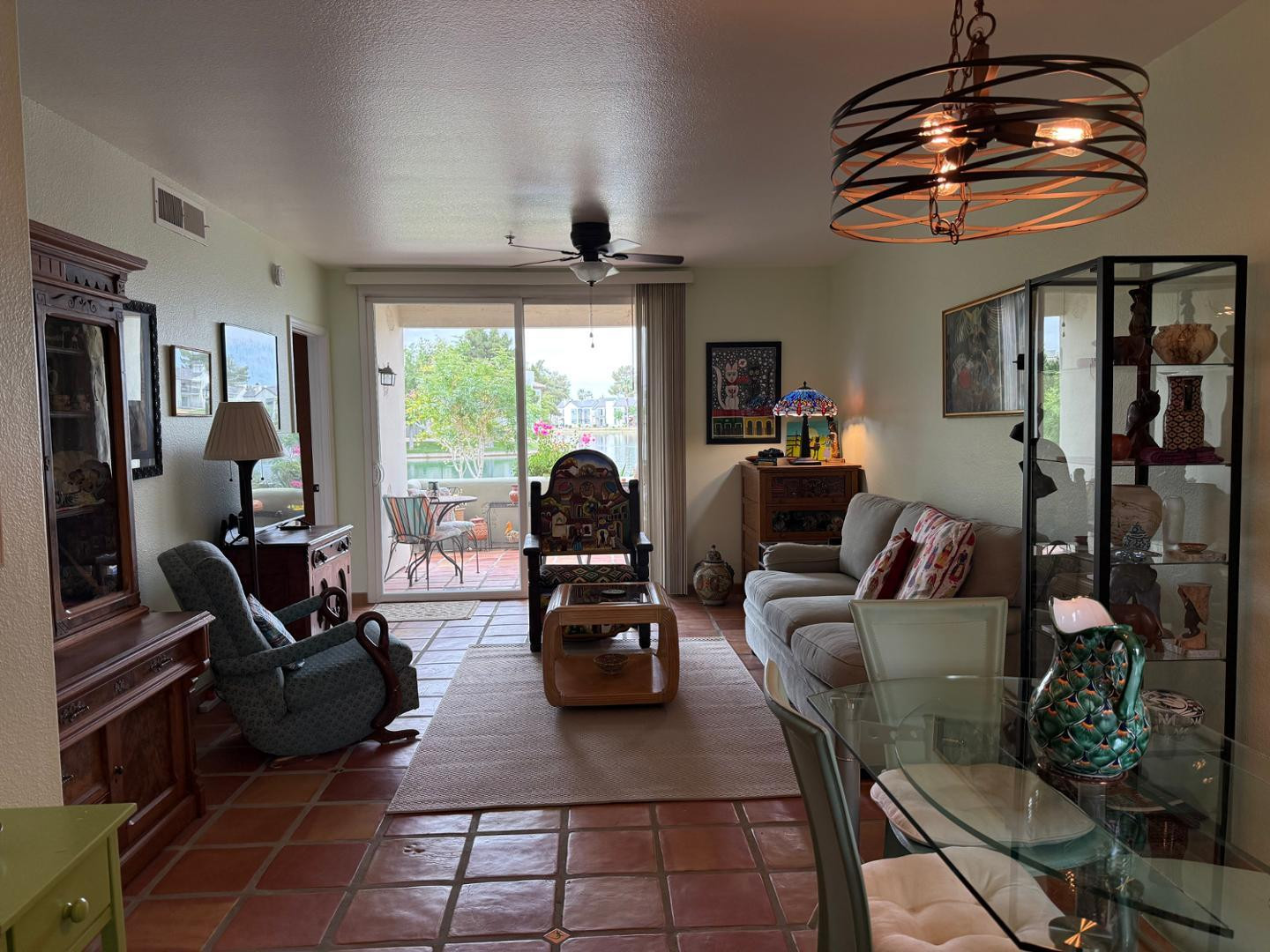 1825 West Ray Road, Unit 1012 Chandler, AZ 85224 - Photo 11 of 34 a living room with furniture a chandelier and a large window