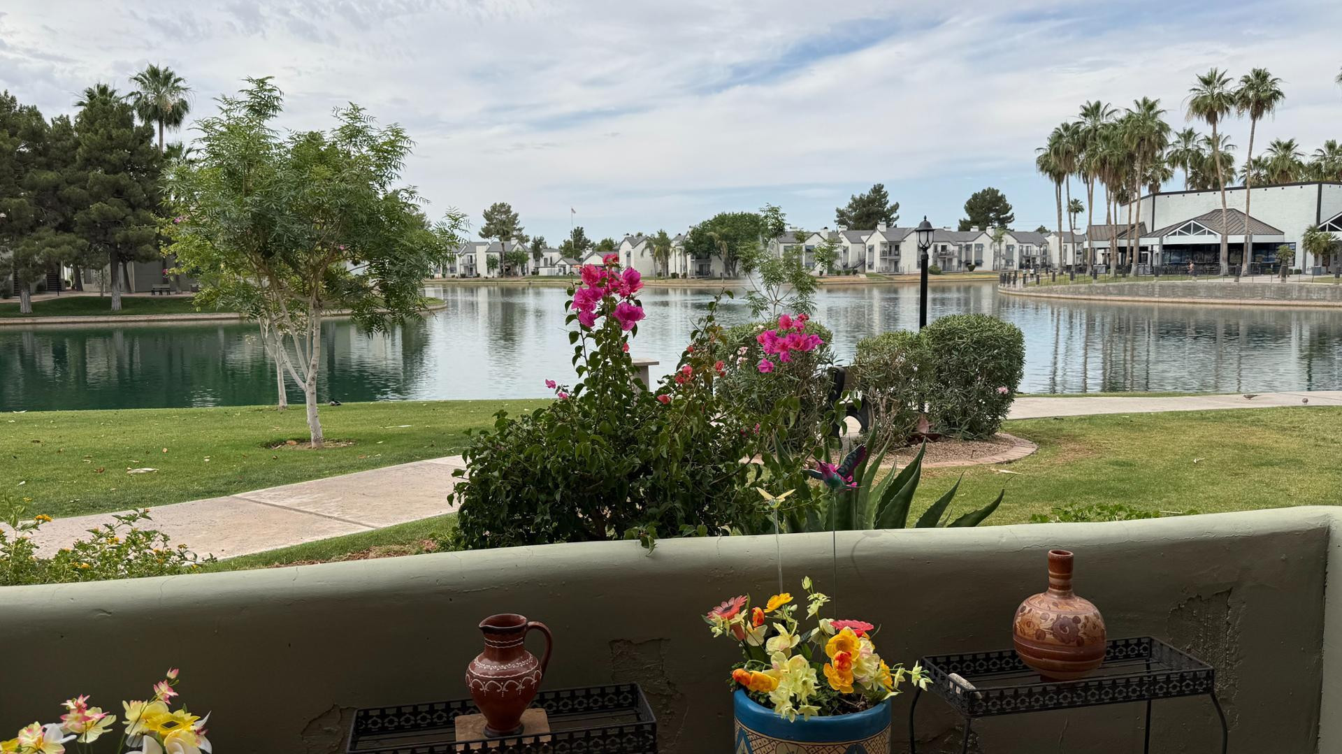 1825 West Ray Road, Unit 1012 Chandler, AZ 85224 - Photo 2 of 34 a front view of a house with a yard and a fountain