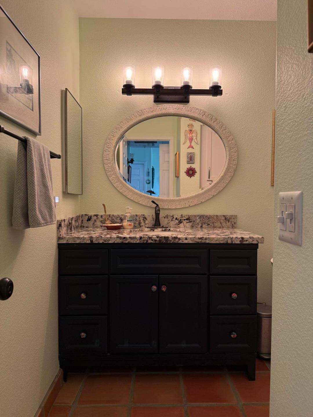 1825 West Ray Road, Unit 1012 Chandler, AZ 85224 - Photo 21 of 34 a bathroom with a sink vanity and mirror