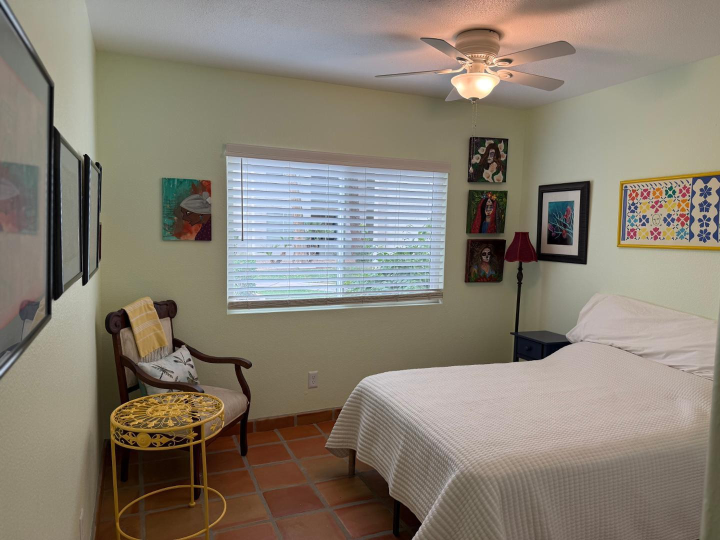 1825 West Ray Road, Unit 1012 Chandler, AZ 85224 - Photo 24 of 34 a bedroom with a bed and a chandelier