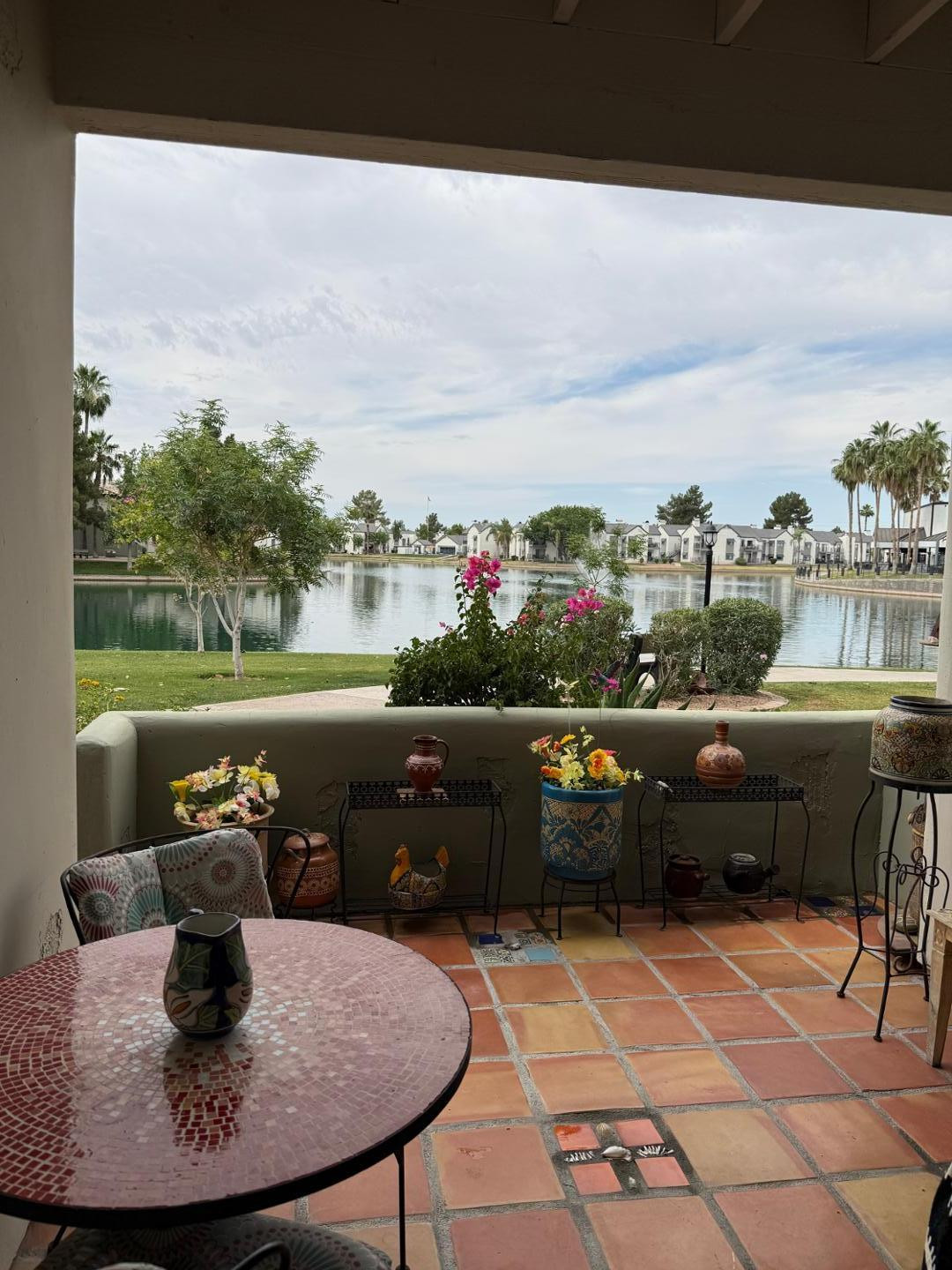 1825 West Ray Road, Unit 1012 Chandler, AZ 85224 - Photo 3 of 34 a view of a chairs and table in the terrace
