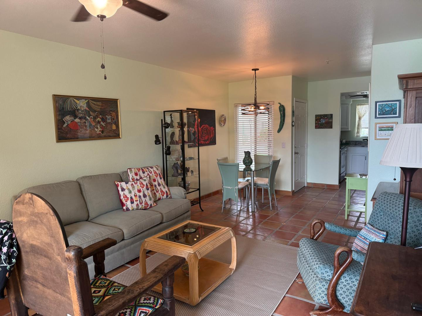 1825 West Ray Road, Unit 1012 Chandler, AZ 85224 - Photo 32 of 34 a living room with furniture and a chandelier