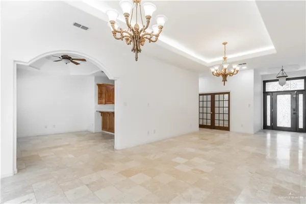 en view of a chandelier and a chandelier in a room