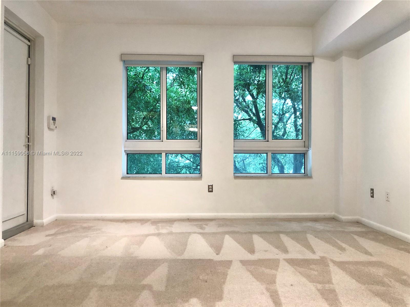 7371 Southwest 90th Street, Unit TH106S Miami, FL 33156 - Photo 11 of 25 a view of an empty room with a window