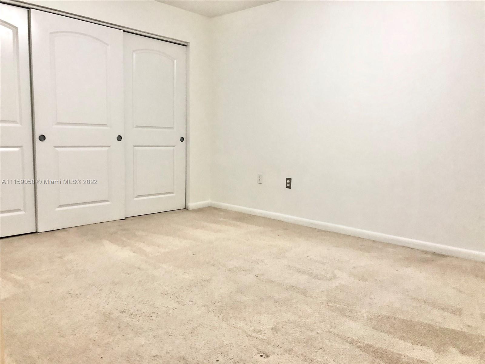 7371 Southwest 90th Street, Unit TH106S Miami, FL 33156 - Photo 14 of 25 a view of an empty room
