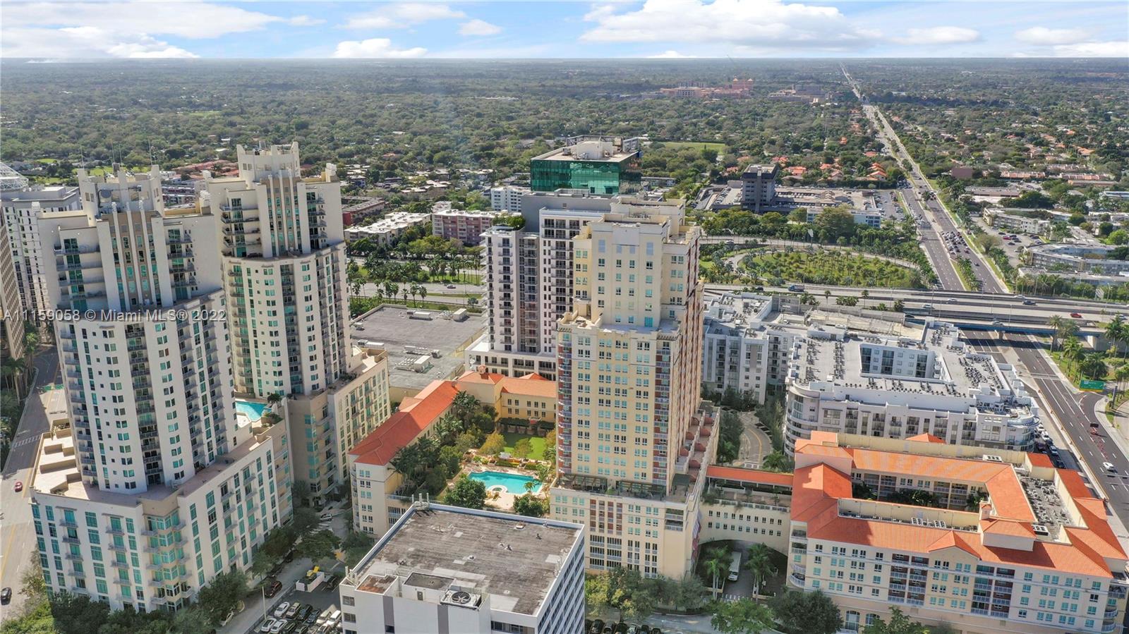 7371 Southwest 90th Street, Unit TH106S Miami, FL 33156 - Photo 19 of 25 a view of a city with tall buildings