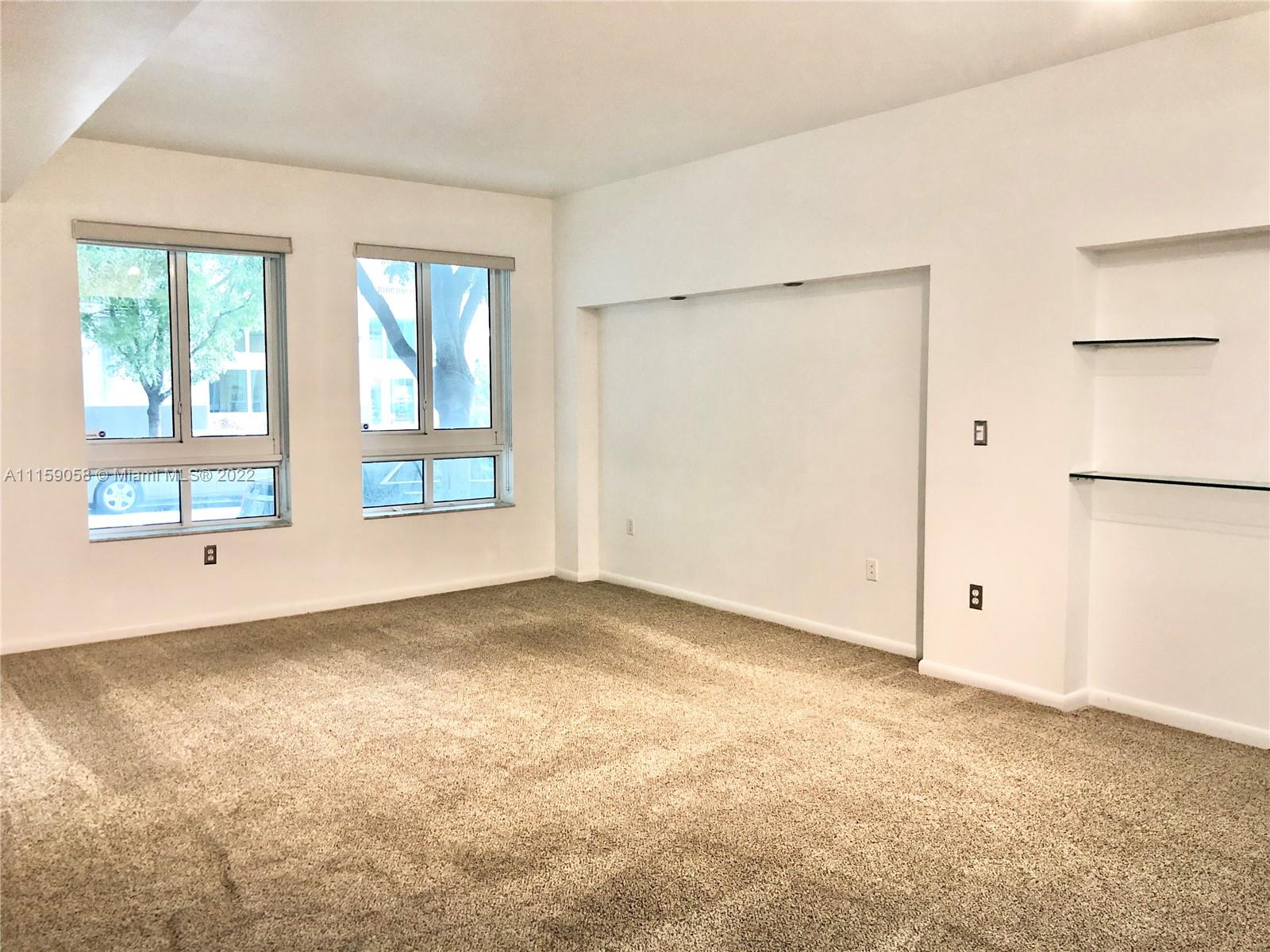 7371 Southwest 90th Street, Unit TH106S Miami, FL 33156 - Photo 6 of 25 an empty room with windows and closet