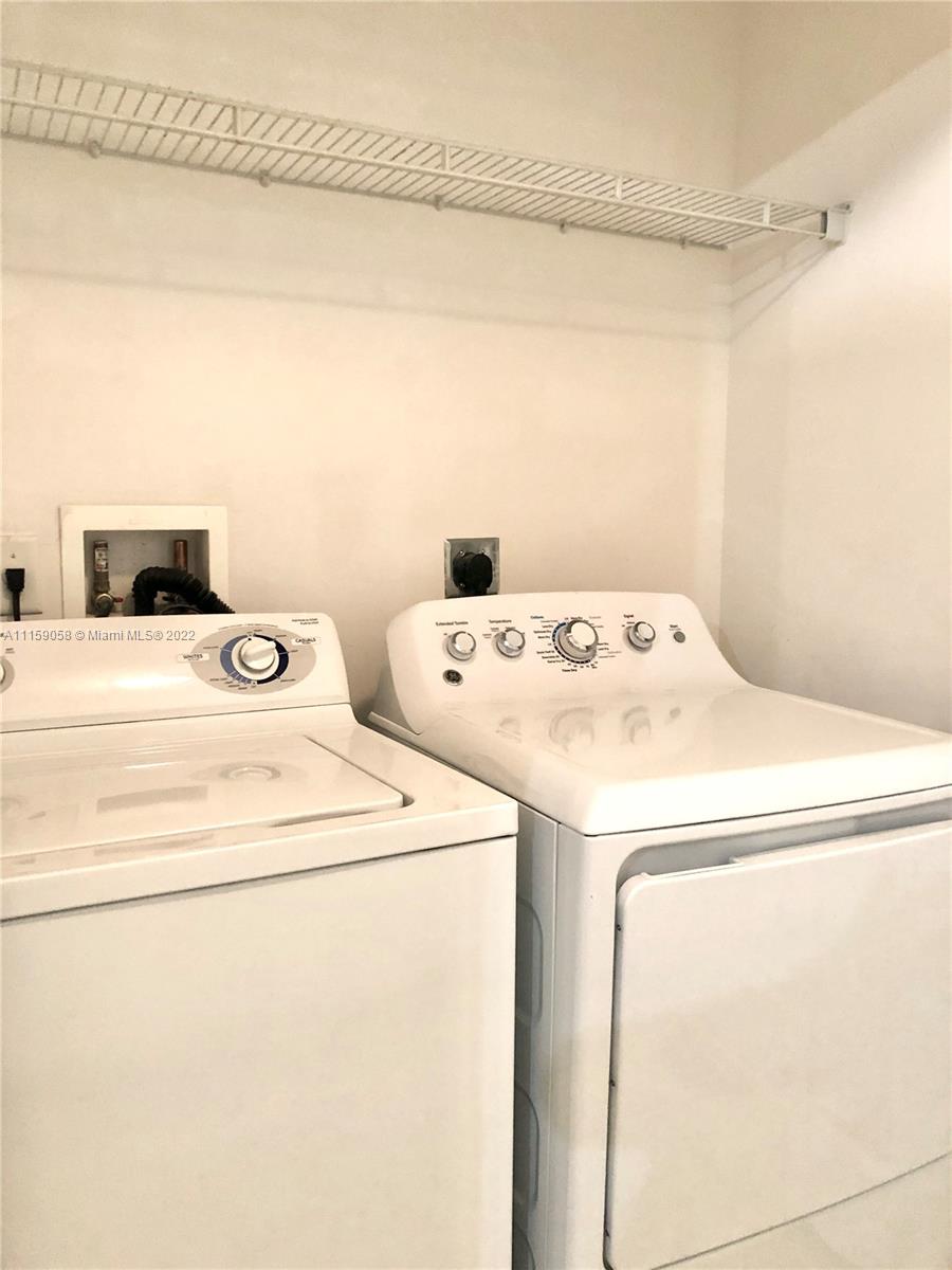 7371 Southwest 90th Street, Unit TH106S Miami, FL 33156 - Photo 10 of 25 a utility room with dryer and washer