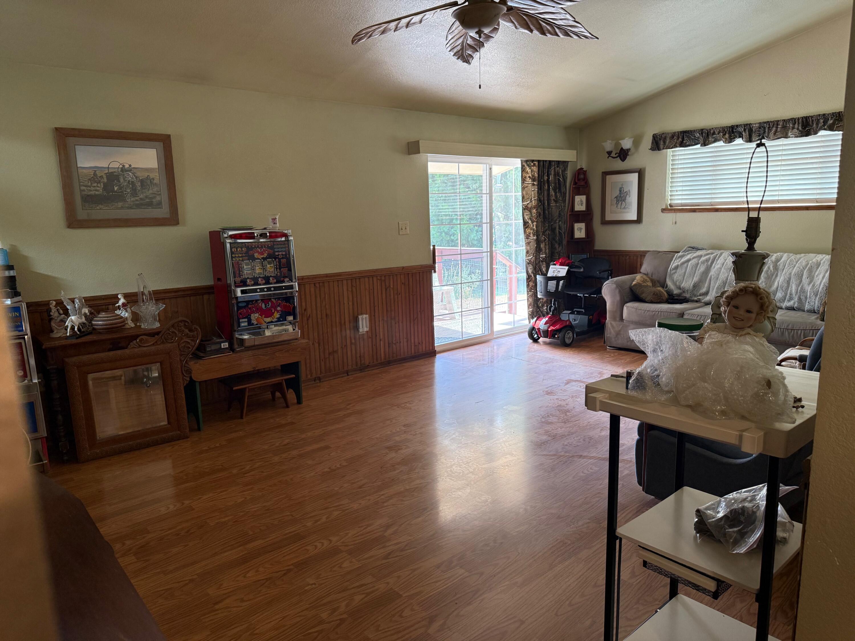 1800 Dick George Road Cave Junction, OR 97523 - Photo 11 of 37 family room, door to deck & spa