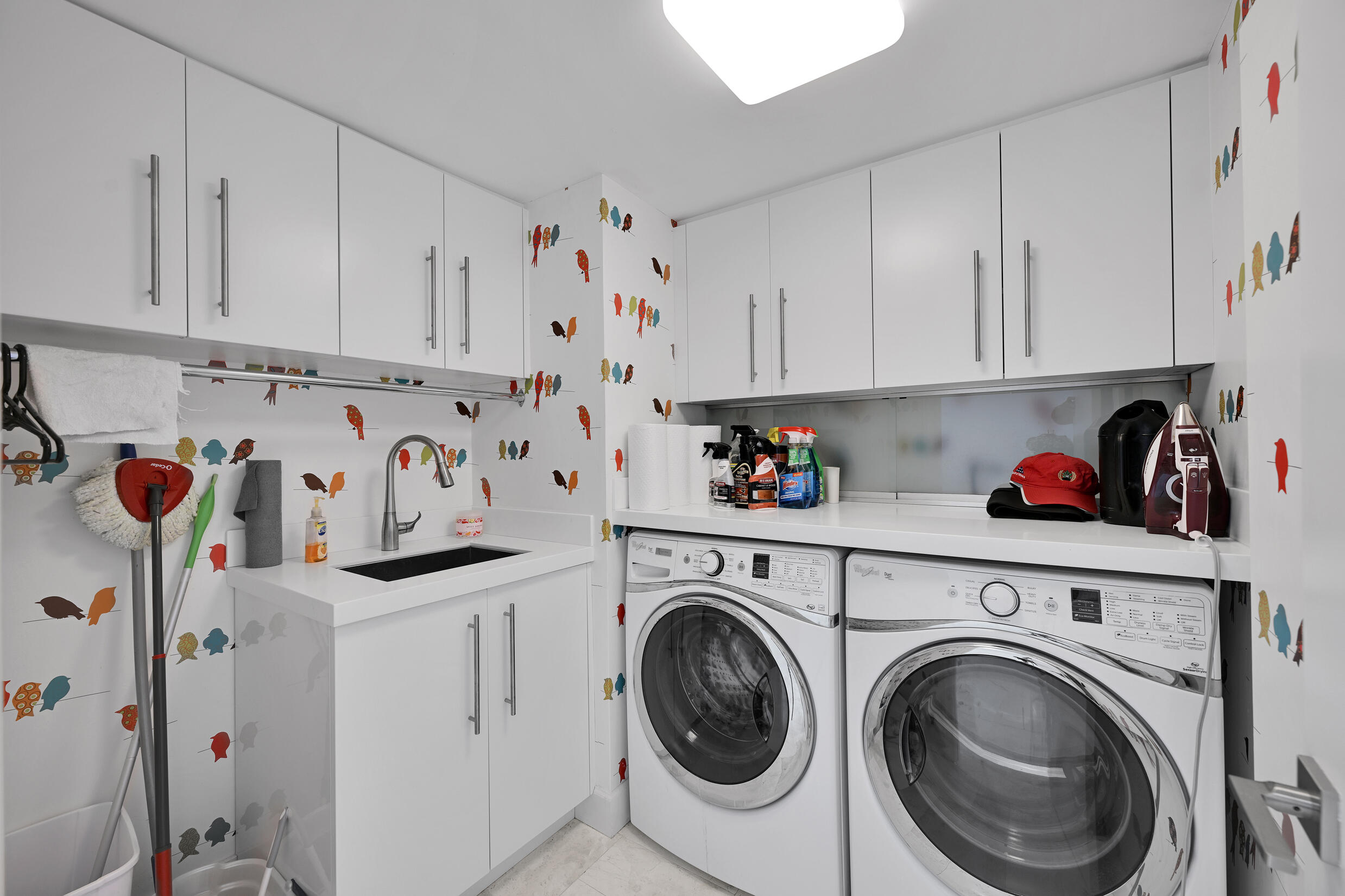 3300 South Ocean Boulevard, Unit 508S Palm Beach, FL 33480 - Photo 17 of 28 a view of kitchen with washer and dryer