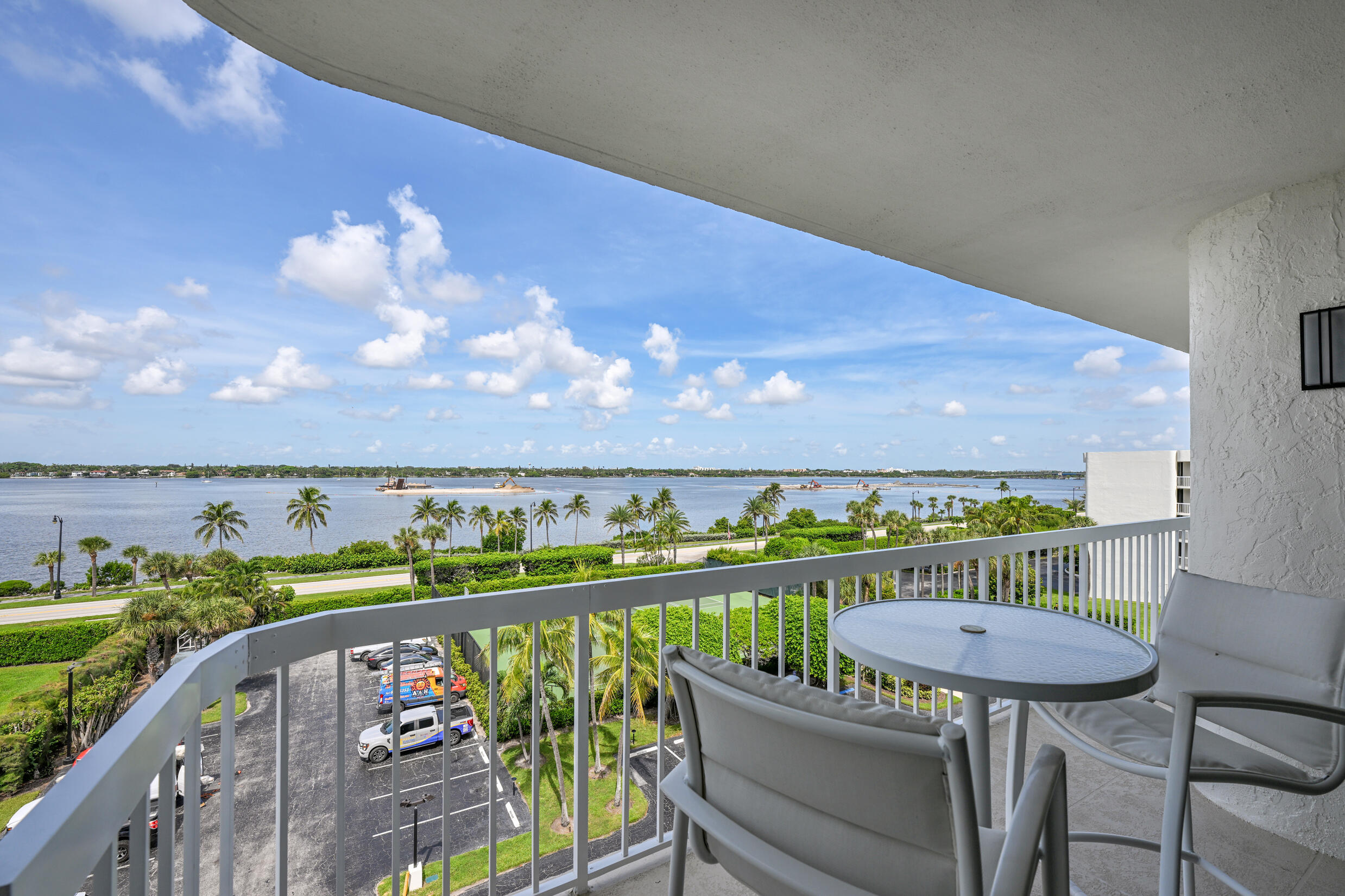 3300 South Ocean Boulevard, Unit 508S Palm Beach, FL 33480 - Photo 21 of 28 a view of a balcony with two chairs and a table