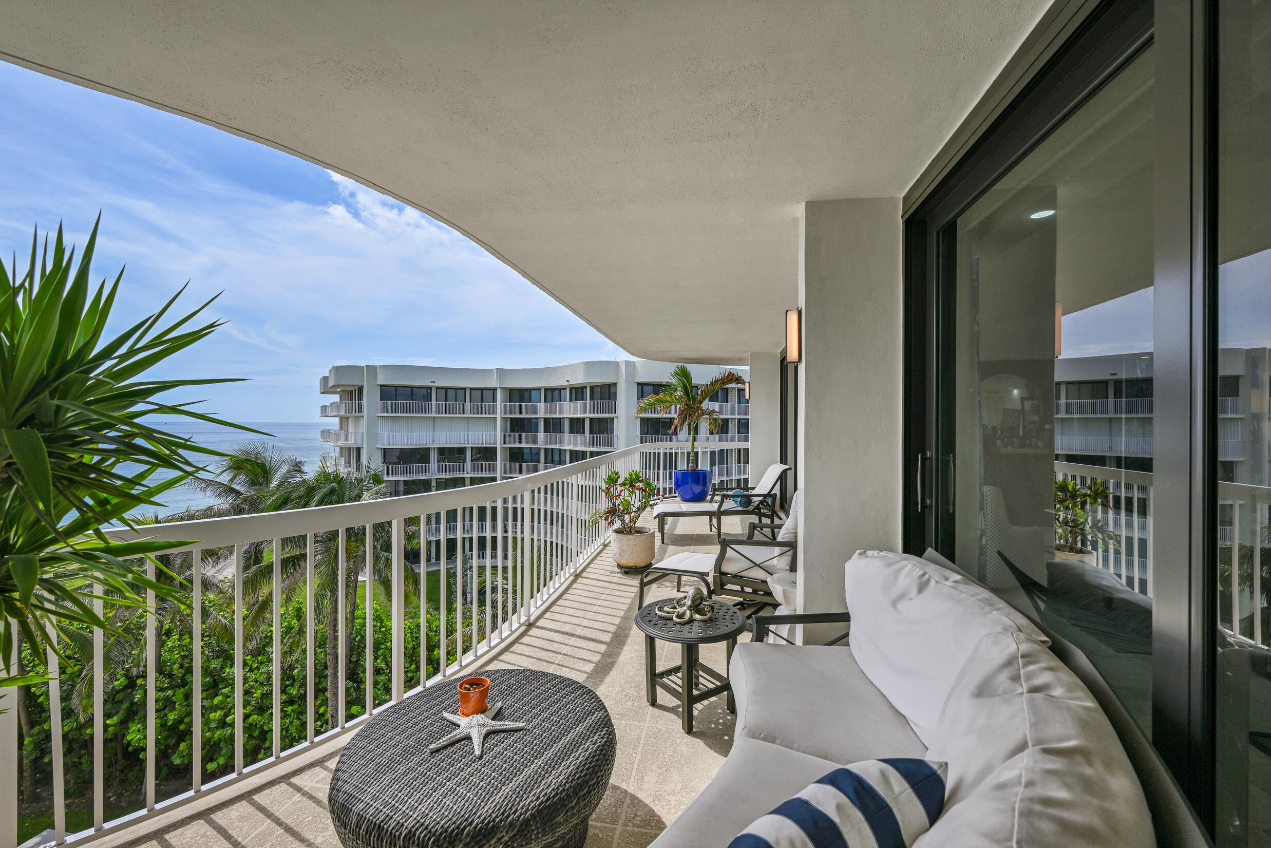 3300 South Ocean Boulevard, Unit 508S Palm Beach, FL 33480 - Photo 22 of 28 a balcony with furniture and a potted plant