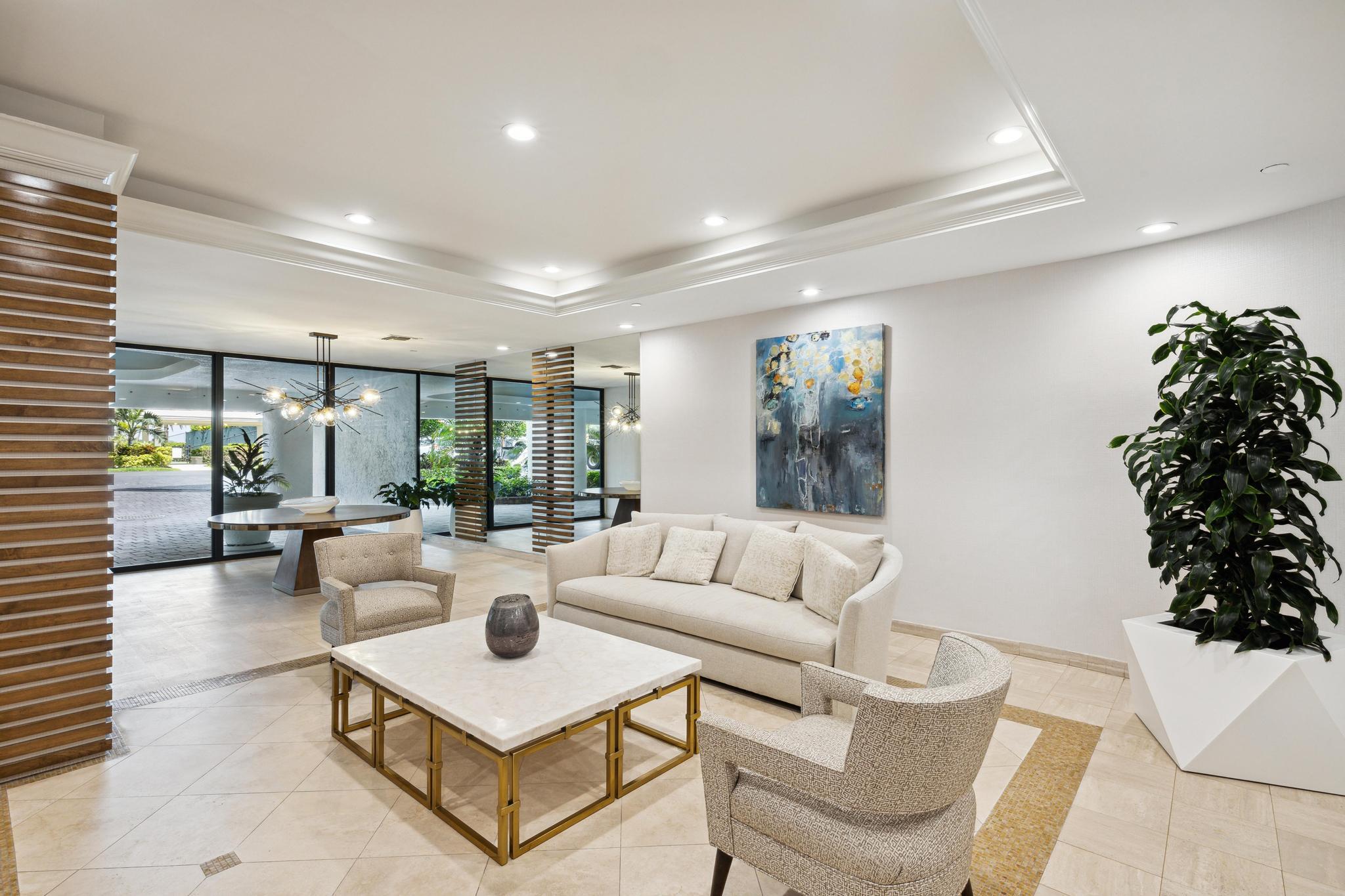 3300 South Ocean Boulevard, Unit 508S Palm Beach, FL 33480 - Photo 25 of 28 a living room with furniture plant and a large window