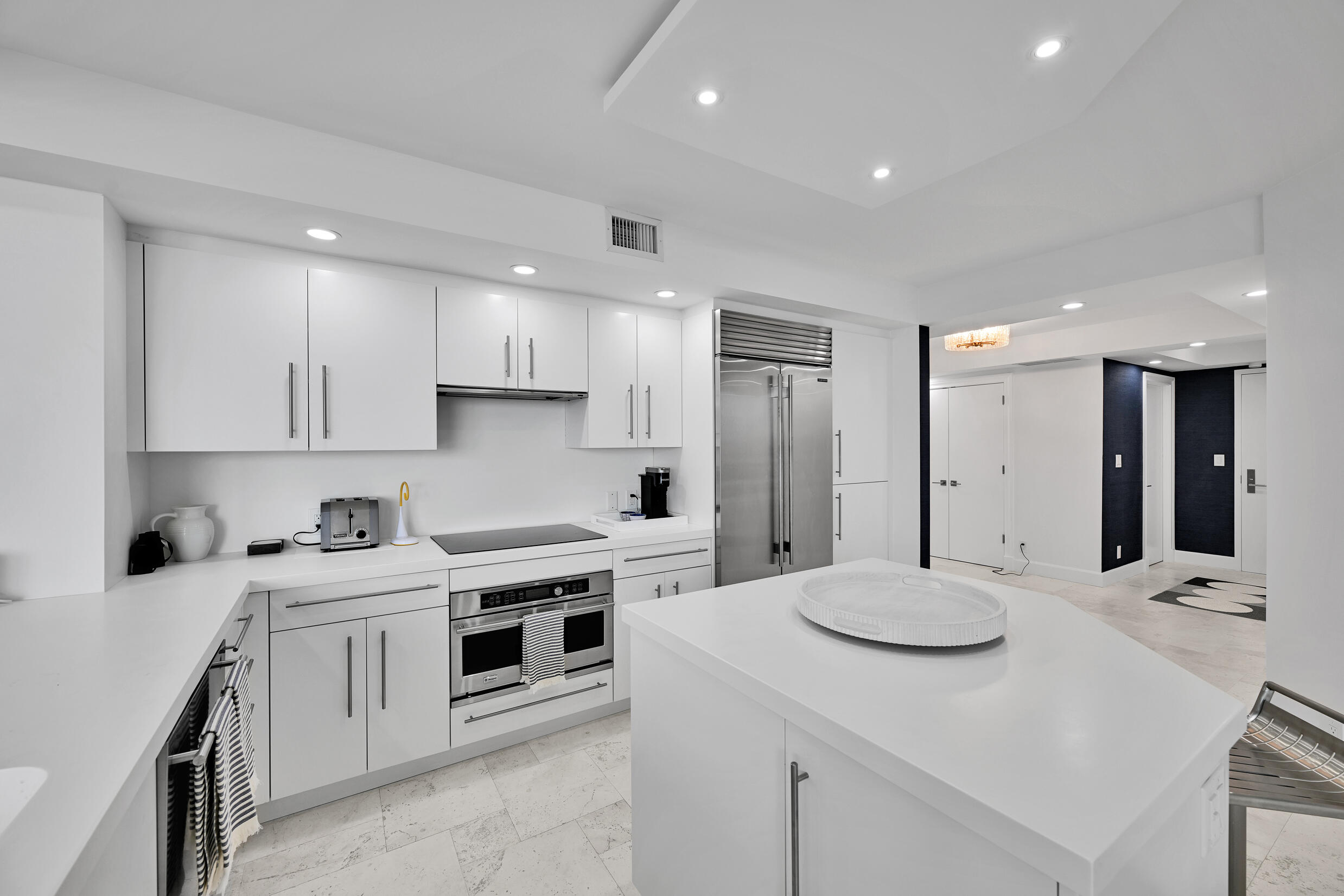 3300 South Ocean Boulevard, Unit 508S Palm Beach, FL 33480 - Photo 8 of 28 a kitchen with a sink stove and refrigerator