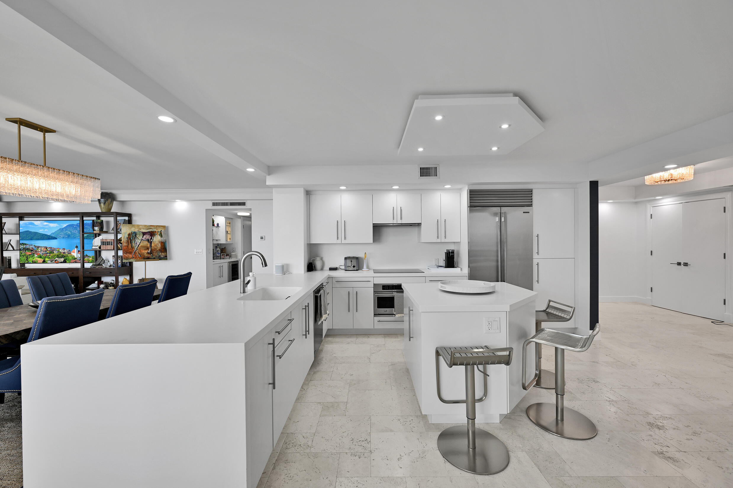3300 South Ocean Boulevard, Unit 508S Palm Beach, FL 33480 - Photo 9 of 28 a large white kitchen with sink stove and refrigerator