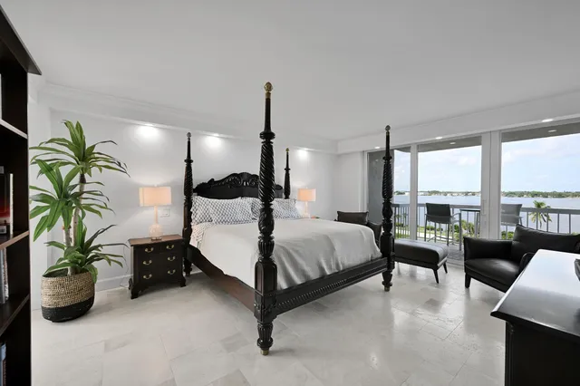 a bed room with a bed and a book shelf