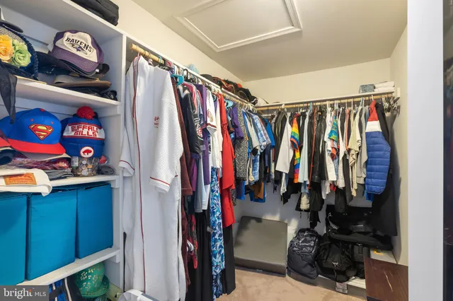a bathroom with a granite countertop sink mirror vanity and toilet